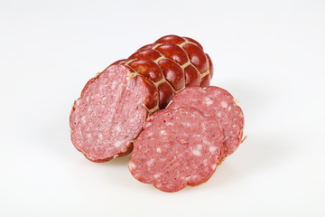 Tasty meat sausages over white background