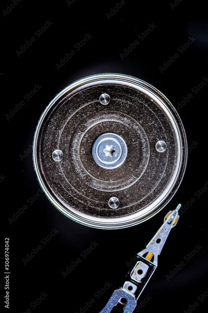 Poster disassembled hard drive from the computer, hdd with mirror effect. opened hard drive from the comput