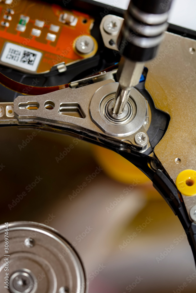 Poster disassembled hard drive from the computer, hdd with mirror effect. opened hard drive from the comput
