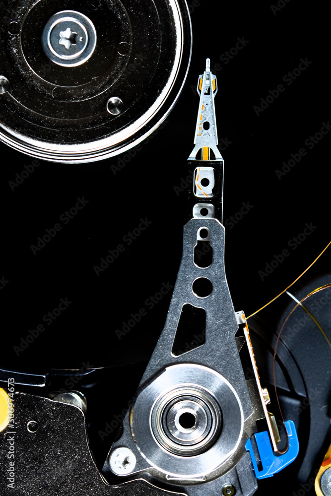 Poster disassembled hard drive from the computer, hdd with mirror effect. opened hard drive from the comput