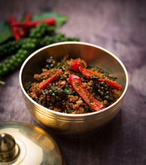 Stir Fried fish with Yellow Curry Paste on wood table,Thai food