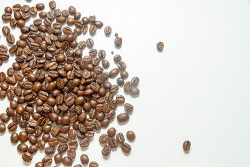 Coffee beans on the white background. with peace of cloth. Brown beans.