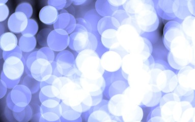 Festive abstract background from highlights on a blue background, Christmas and New Year style, magic illumination from garlands