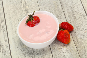 Yoghurt with strawberry in the bowl