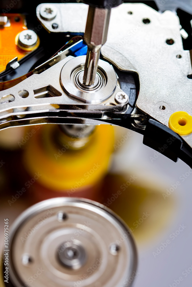 Poster disassembled hard drive from the computer, hdd with mirror effect. opened hard drive from the comput