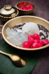 Coconut milk ice cream on brass blow with thai sweet sticky rice,chestnuts ,and sweet potatoes