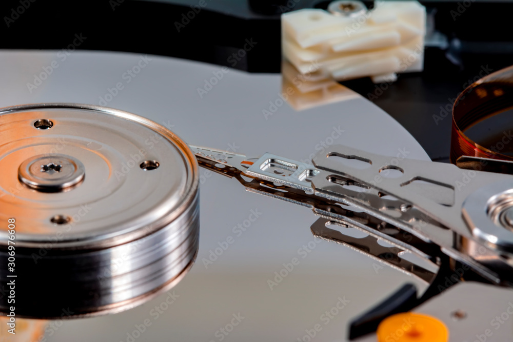 Poster disassembled hard drive from the computer, hdd with mirror effect. opened hard drive from the comput