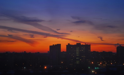 Naklejka premium Night sky over houses of metropolis