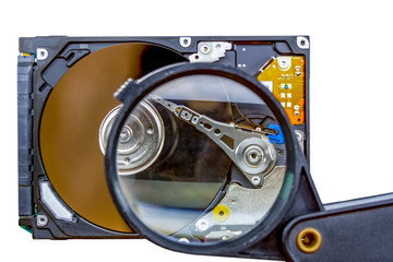 Disassembled hard drive from the computer, hdd with mirror effect. Opened hard drive from the computer hdd disk drive with mirror effects. Part of computer pc, laptop.