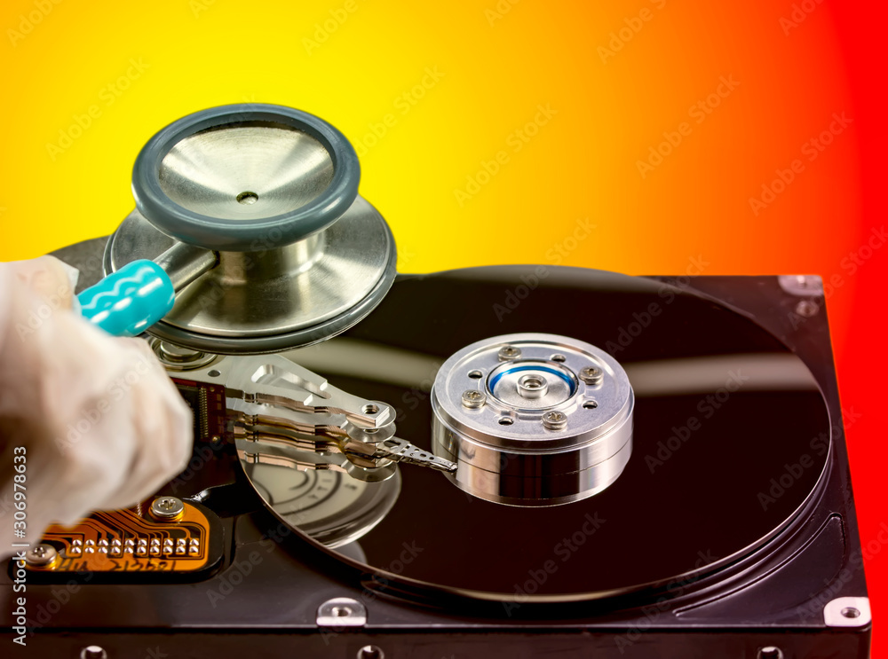 Poster disassembled hard drive from the computer, hdd with mirror effect. opened hard drive from the comput