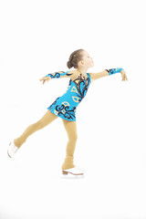 Figure skater little girl skating on ice isolated on white background.