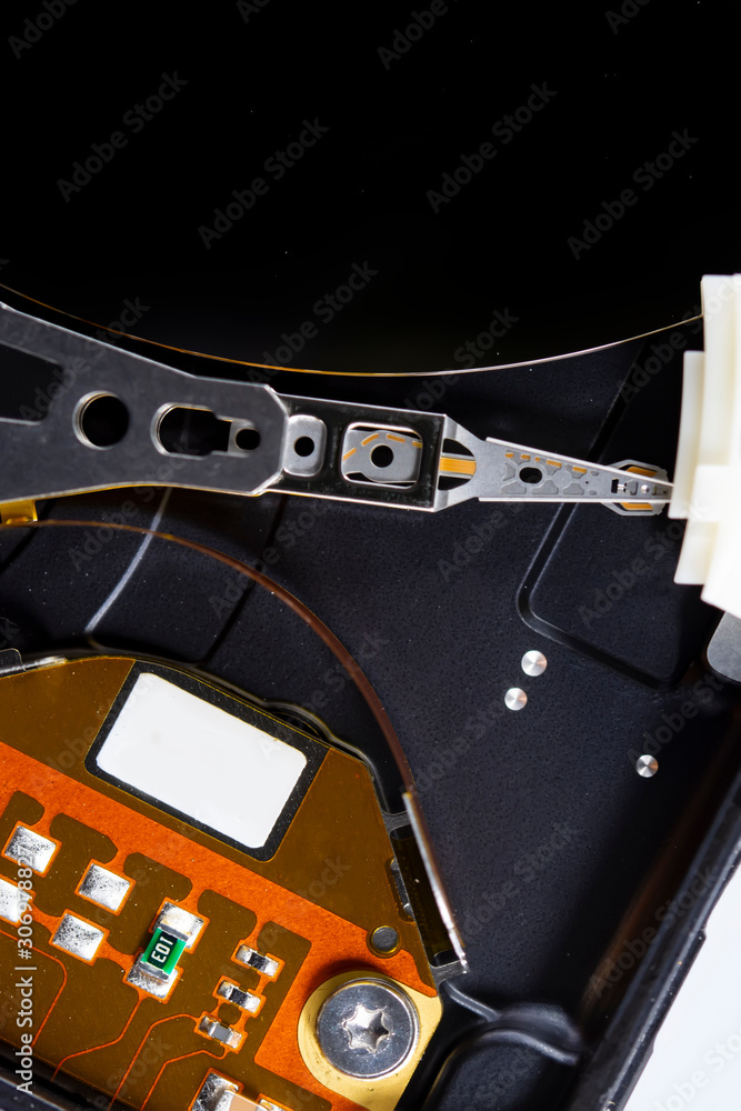 Poster disassembled hard drive from the computer, hdd with mirror effect. opened hard drive from the comput