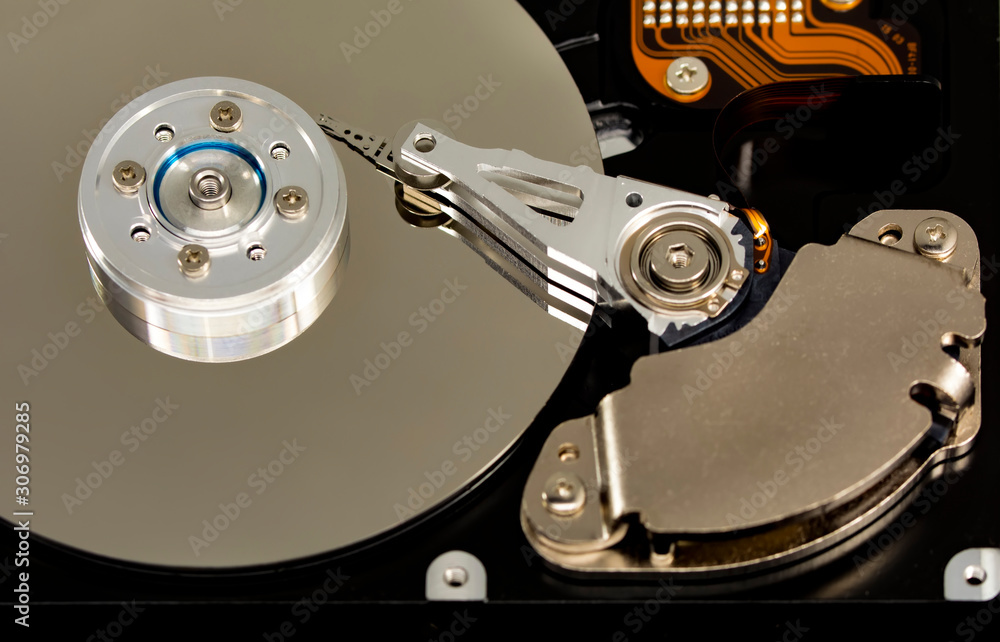 Poster disassembled hard drive from the computer, hdd with mirror effect. opened hard drive from the comput