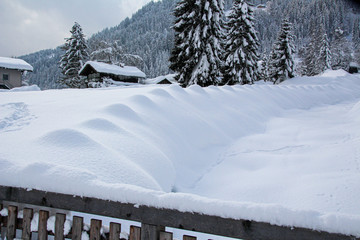 winter impressions with much snow and blue sky as background