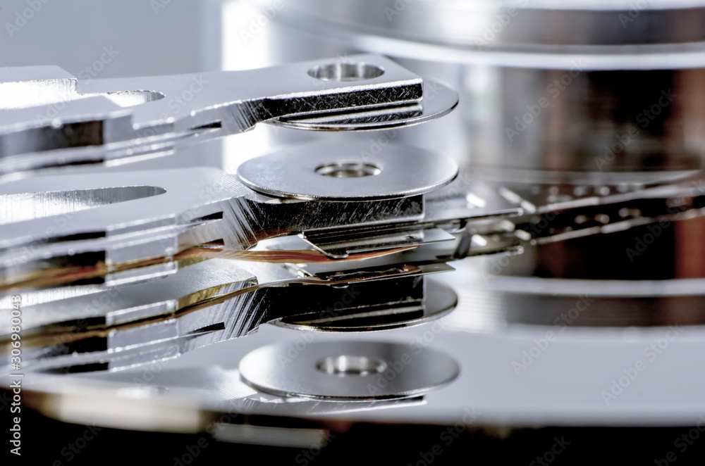 Poster disassembled hard drive from the computer, hdd with mirror effect. opened hard drive from the comput