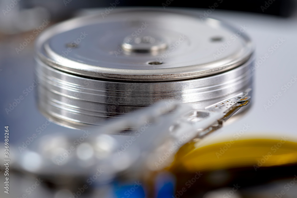 Poster disassembled hard drive from the computer, hdd with mirror effect. opened hard drive from the comput