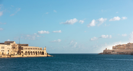 blue sky and blue water of mediterranean sea at bay in malta