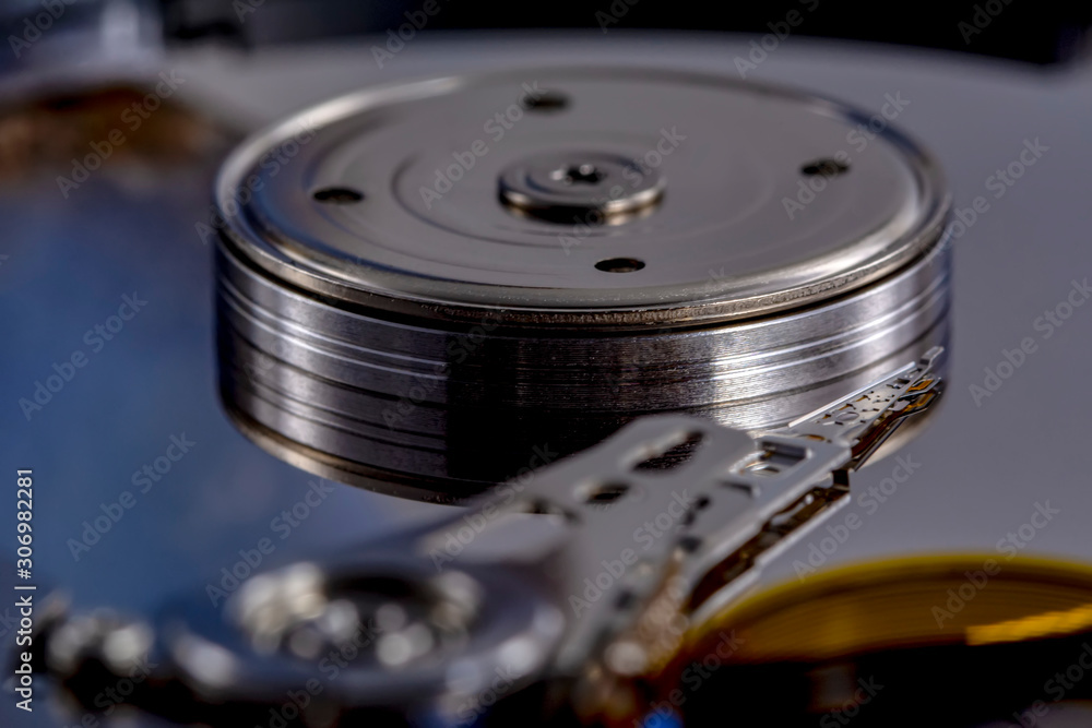 Poster disassembled hard drive from the computer, hdd with mirror effect. opened hard drive from the comput