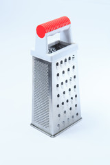 Coarse grater for vegetables on a white background