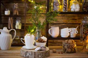 Christmas decoration cocoa bar with cookies and sweets on old wo