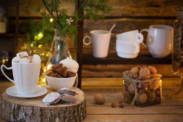 Christmas decoration cocoa bar with cookies and sweets on old wo