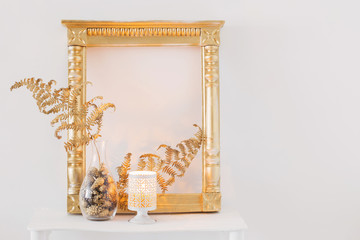  interior decor with burning candles on white wooden shelf