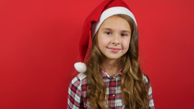 Cute smiling girl counting last seconds before receiving or giving a gift