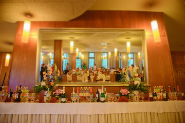 Delicious sweets on candy buffet. Wedding bakes on trays