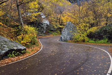 Winding road through boulders at Smugglers Notch State Park Vermont