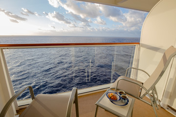 Coffee and pastries on cruise ship balcony early morning