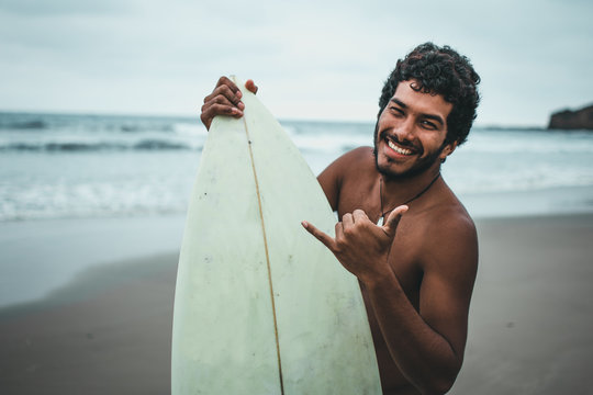  Black boy surfer on the beaches of Montañita, Ecuador