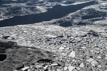 Many small pieces of ice in blue sea water