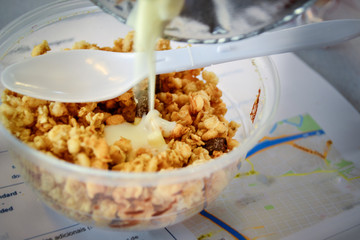 Yogurt served on muesli granola breakfast