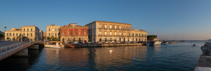 View of the harbour and boats docked in Ortygia island in the province of Syracuse, Sicily, south Italy