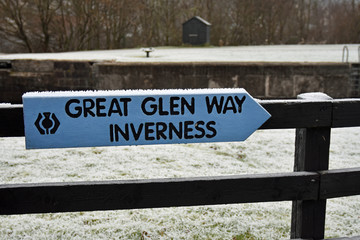 Signpost for the Great Glen Way pointing towards Inverness. This is a famous long distance trail and cycling route in the Scottish Highlands. Taken in winter at Corpach near Fort William