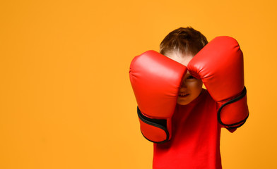 cute little boy with boxing gloves