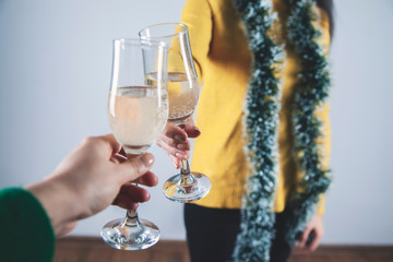 two woman hands a glass of champagne