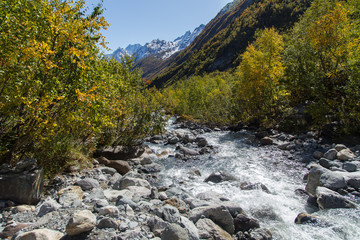 Dombay mountains, trekking in national park to the Alibek waterfall and glacier, autumn landscape