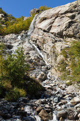 Dombay mountains, trekking in national park to the Alibek waterfall and glacier, autumn landscape