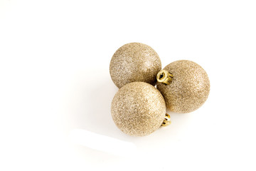   Christmas balls Isolated on a white background. Golden Christmas decorations. The concept of luxury winter holidays. View from above.
