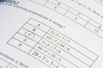 Exam paper with mathematics problem solving.