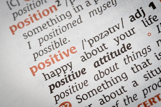 Close-up  of the dictionary word positive.