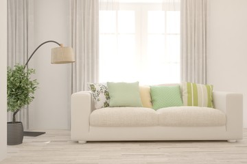 Fototapeta premium Stylish room in white color with sofa. Scandinavian interior design. 3D illustration