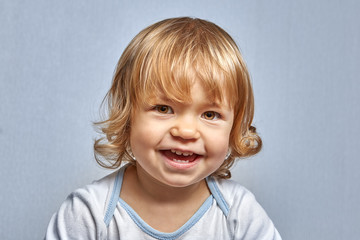 Portrait of little white happy girl.