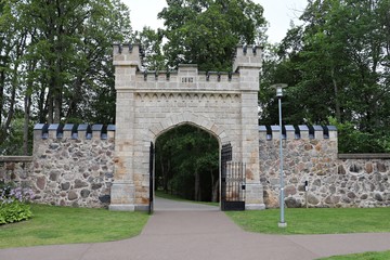 Old stone arch at the entrance to the territory of Sigulda Castle. Latvia, July 2019