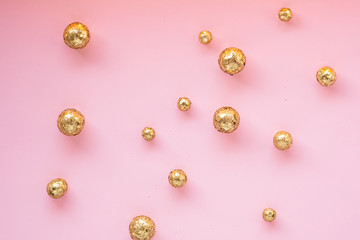 pink background with gold decorative balls. Template banner for greeting card your text design 2020. New year, christmas, birthday