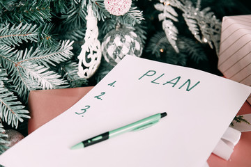 New year goal,plan,action text on notepad with office accessories.