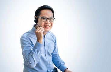 Portrait, asian smart man acting call center,isolated on blue background with clipping path