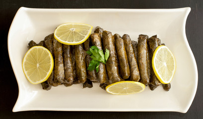 turkish stuffed grape leaves in white plate