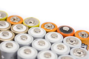 alkaline batteries multi-colored metal and the positive side of the AA-size batteries isolated on...